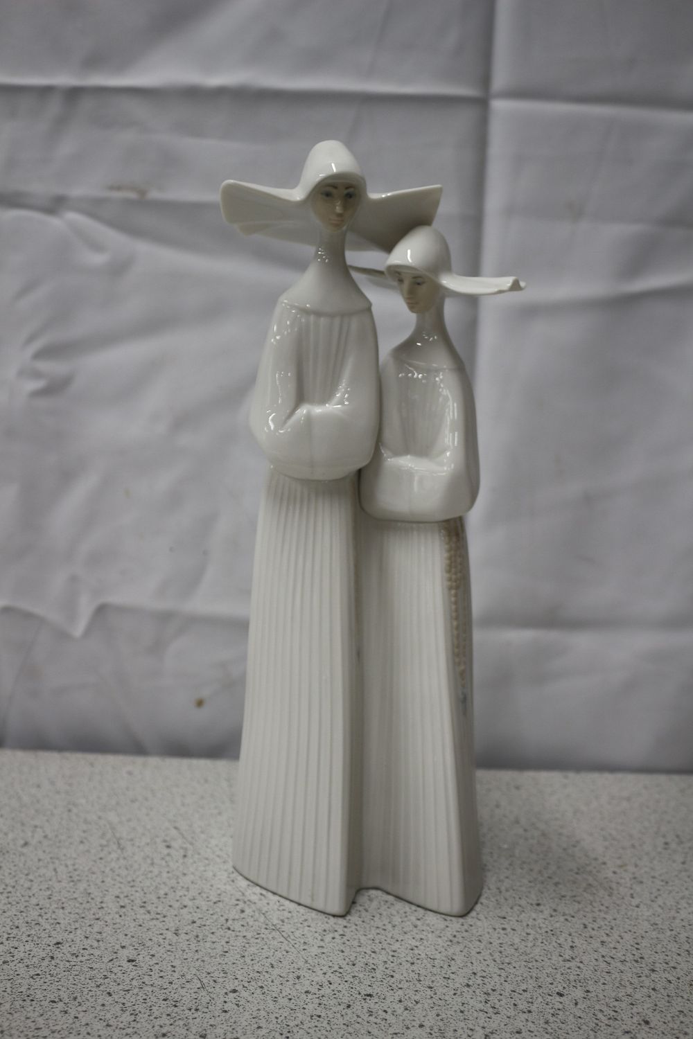 Lot 542: Lladro Porcelain Figurine of Two Nuns, 1978