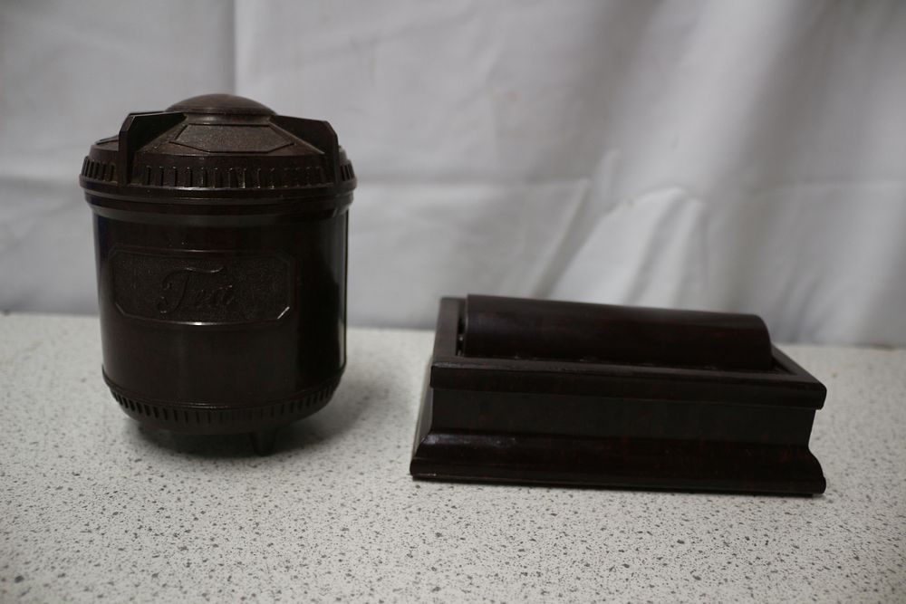 Lot 205: A Pair of Bakelite Tea Canister and Roller Damper
