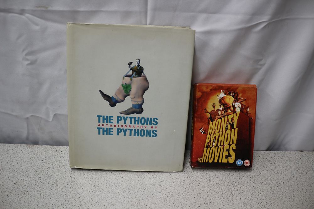 Lot 285: Two Monty Python Items: Autobiography Book and DVD Set