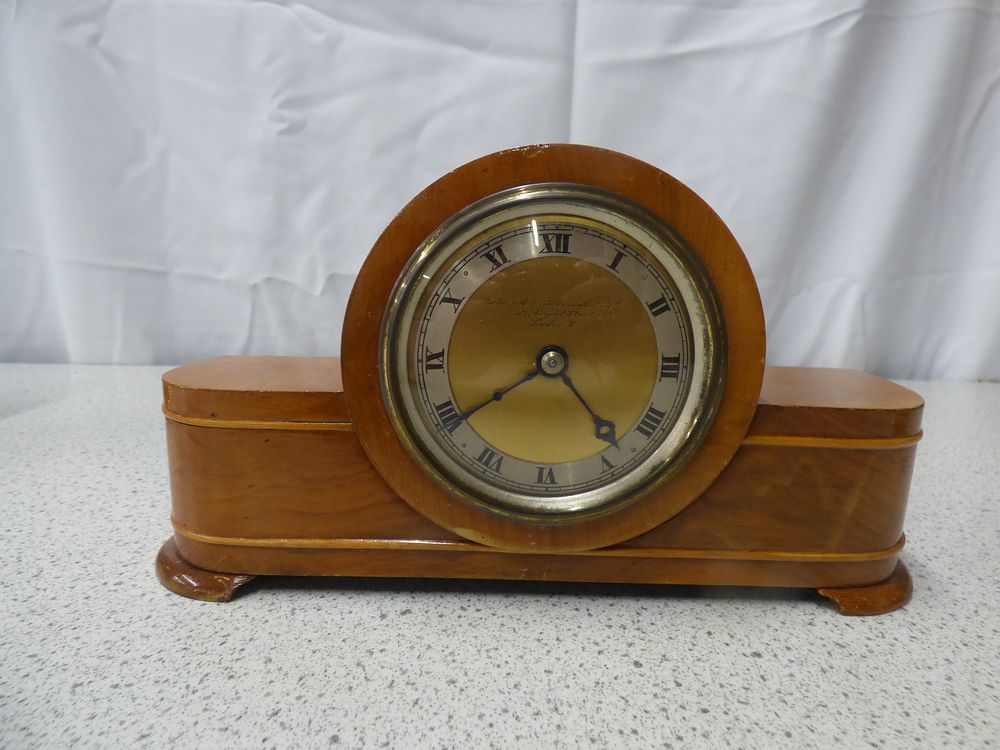 Lot 440: A Goldsmiths & Silversmiths Co Ltd Wooden Mantle Clock