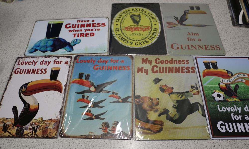 Lot 586: A Collection of Eight Guinness Advertising Metal Signs, featuring Toucans