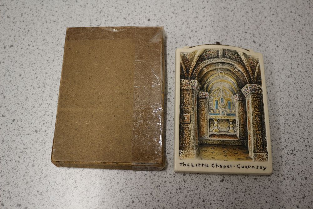 Lot 594: A Hand-Painted Relief Wall Plaque Depicting 'The Little Chapel · Guernsey'