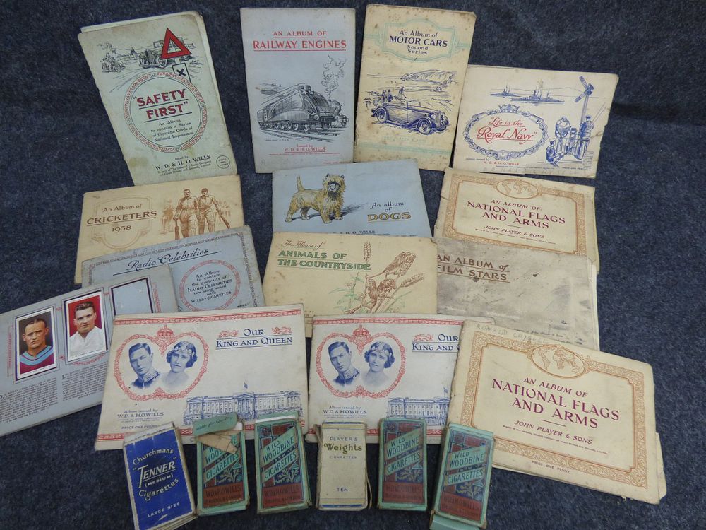 Lot 157: A Collection of Vintage Cigarette Card Albums and Packets