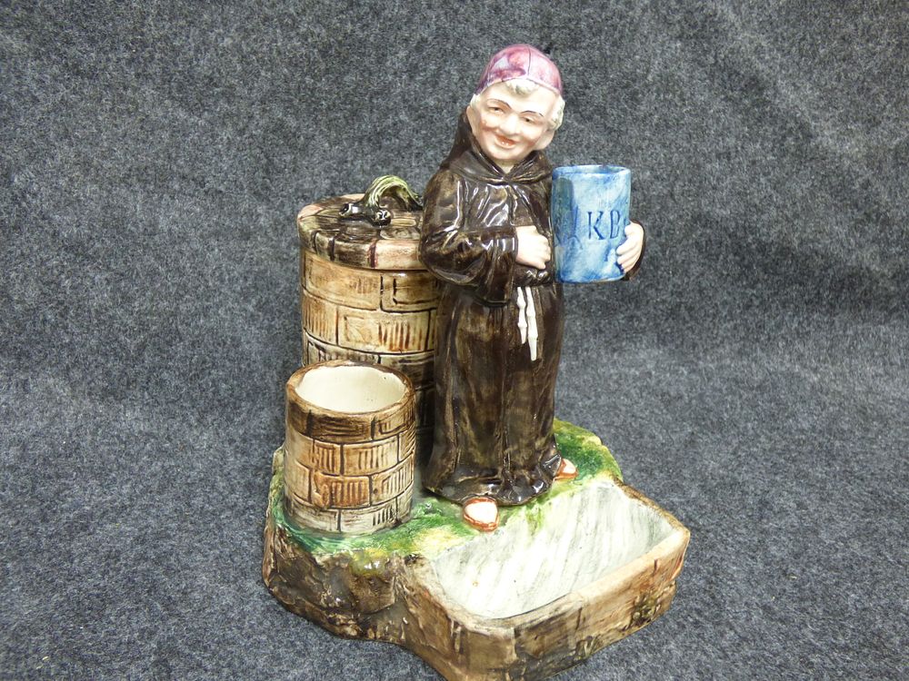 Lot 160: Majolica Figural Monk Tobacco Stand, Match Holder and striker