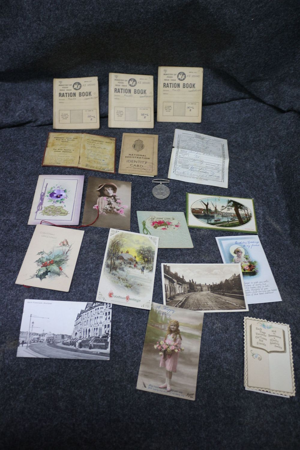 Lot 251: A Collection of Vintage Ephemera Including Ration Books and Postcards