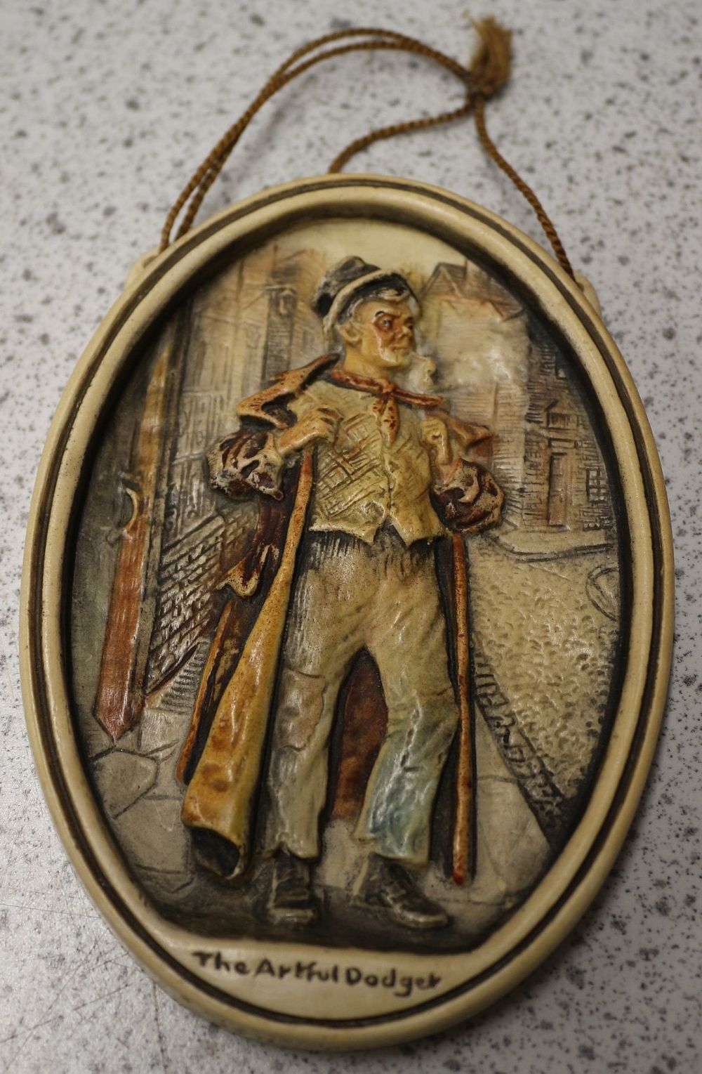 Lot 624: An Arthur Osborne Ivorex 'The Artful Dodger' Wall Plaque, dated 1982