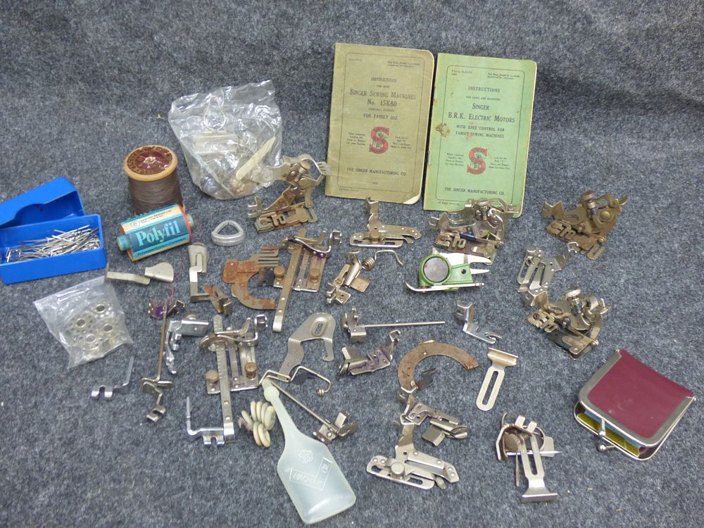 Lot 168: A Collection of Vintage Sewing Machine Attachments and Manuals