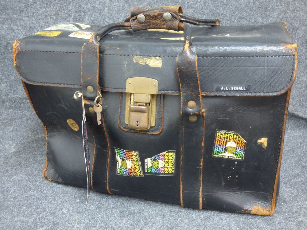 Lot 193: Vintage Black Leather Pilot Flight Bag with Travel Stickers