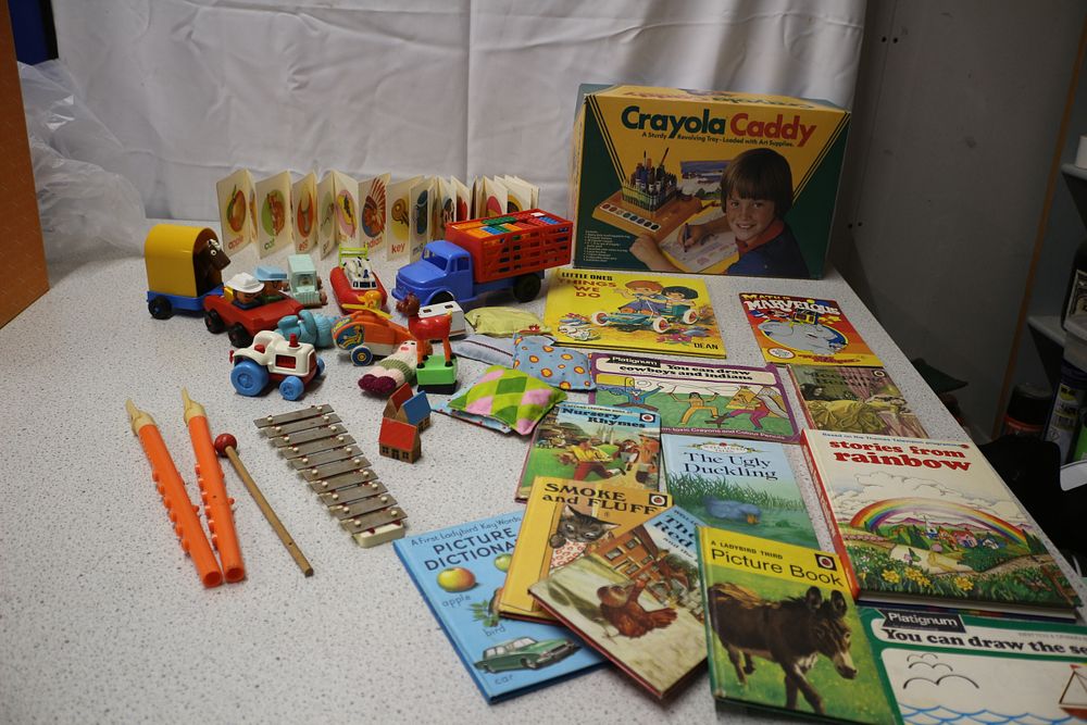 Lot 313: Collection of Vintage Toys Including Books, instruments and empty box for Crayola Caddy