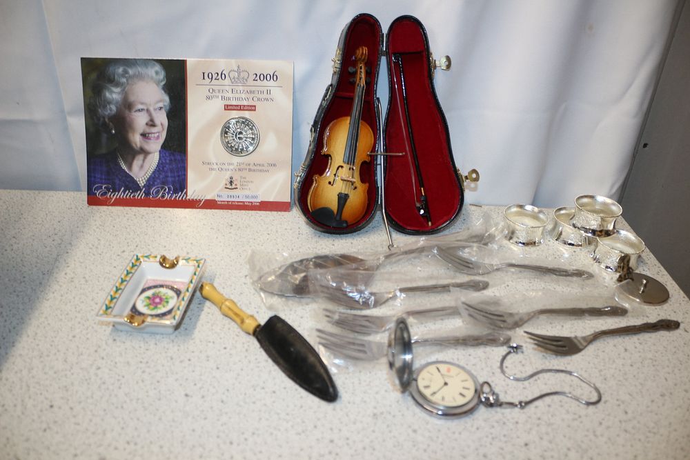 Lot 357: A Mixed Lot of Collectibles Including a Pocket Watch, Queen Elizabeth Limited Edition 80th Birthday Crown Coin and more