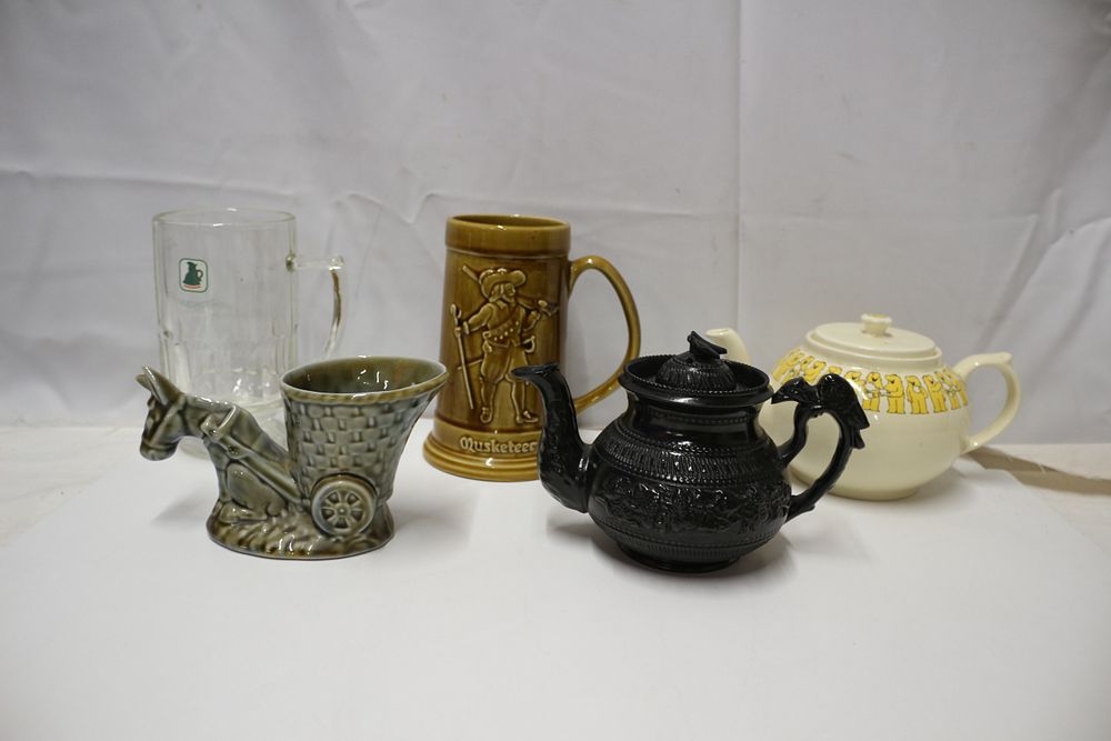 Lot 393: A Collection of Ceramic and Glass Tankards and Teapots