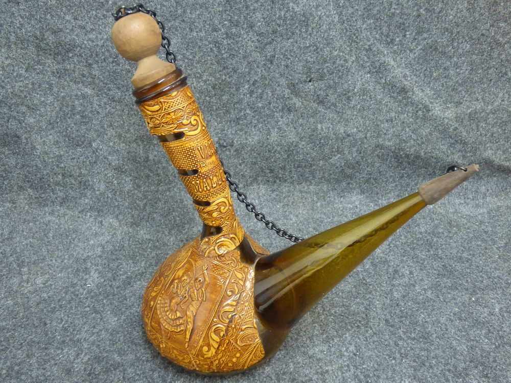 Lot 191: Spanish Tooled Leather Wrapped Glass Porron Decanter