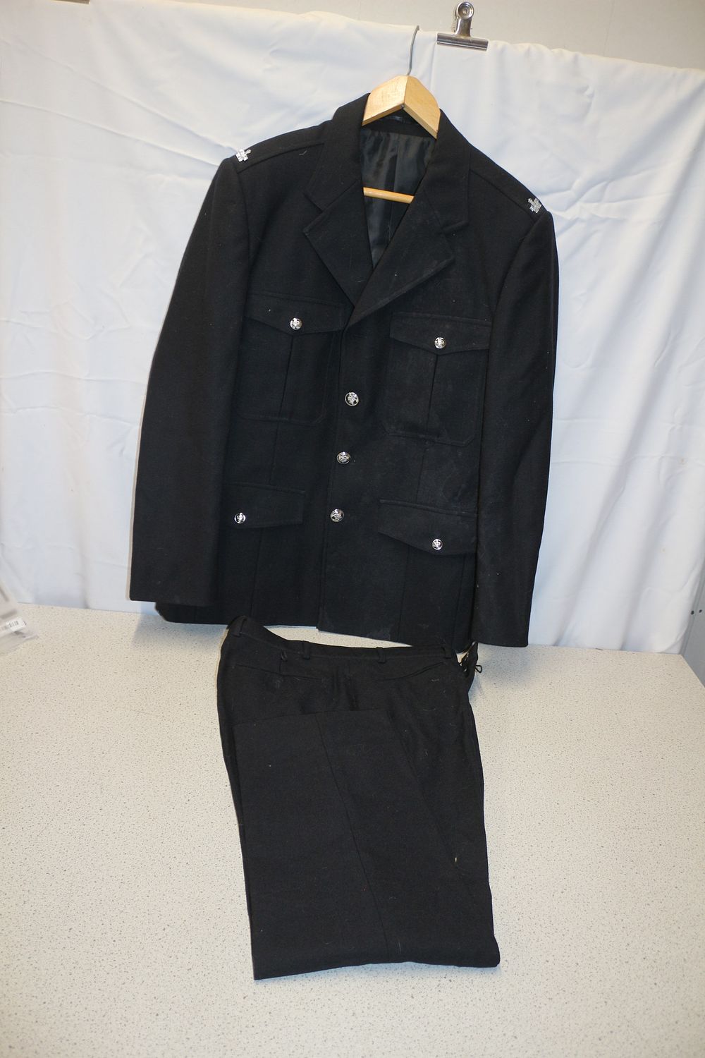 Lot 335: A Black HM Prison Service Two-Piece Uniform