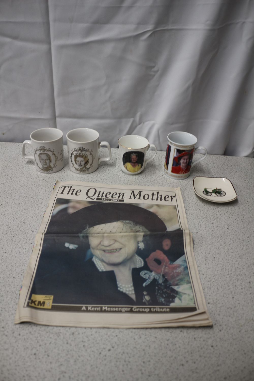 Lot 391: A Collection of Royal Commemorative Mugs, Newspaper, and Dish