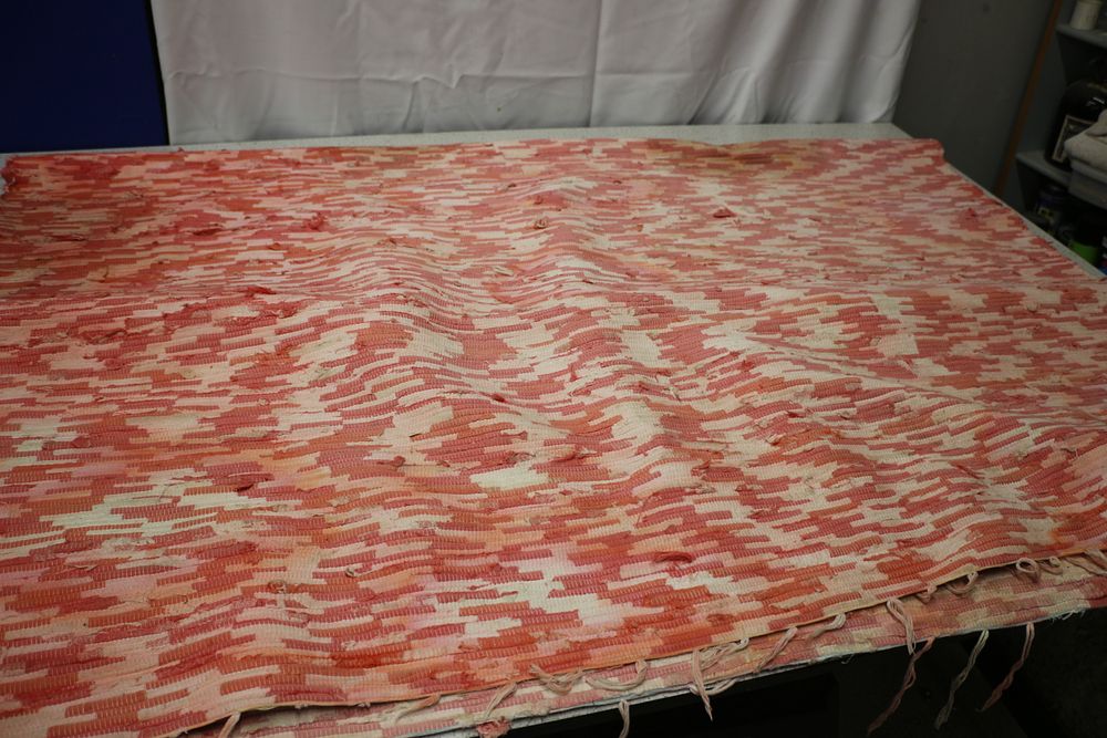 Lot 456: A Large Pink, and Cream Striped Woven Rug