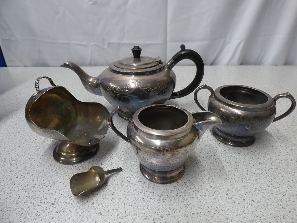 Lot 212: A Five-Piece Silver-Plated Tea Set