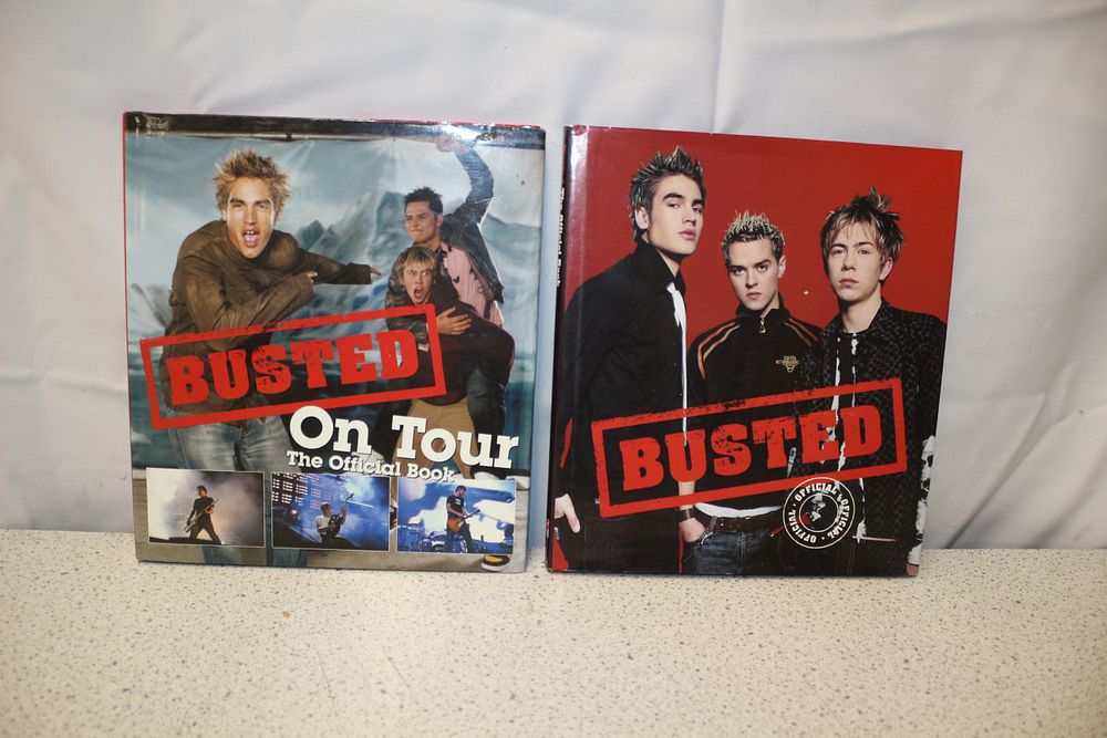 Lot 248: Two Busted Official Band Books