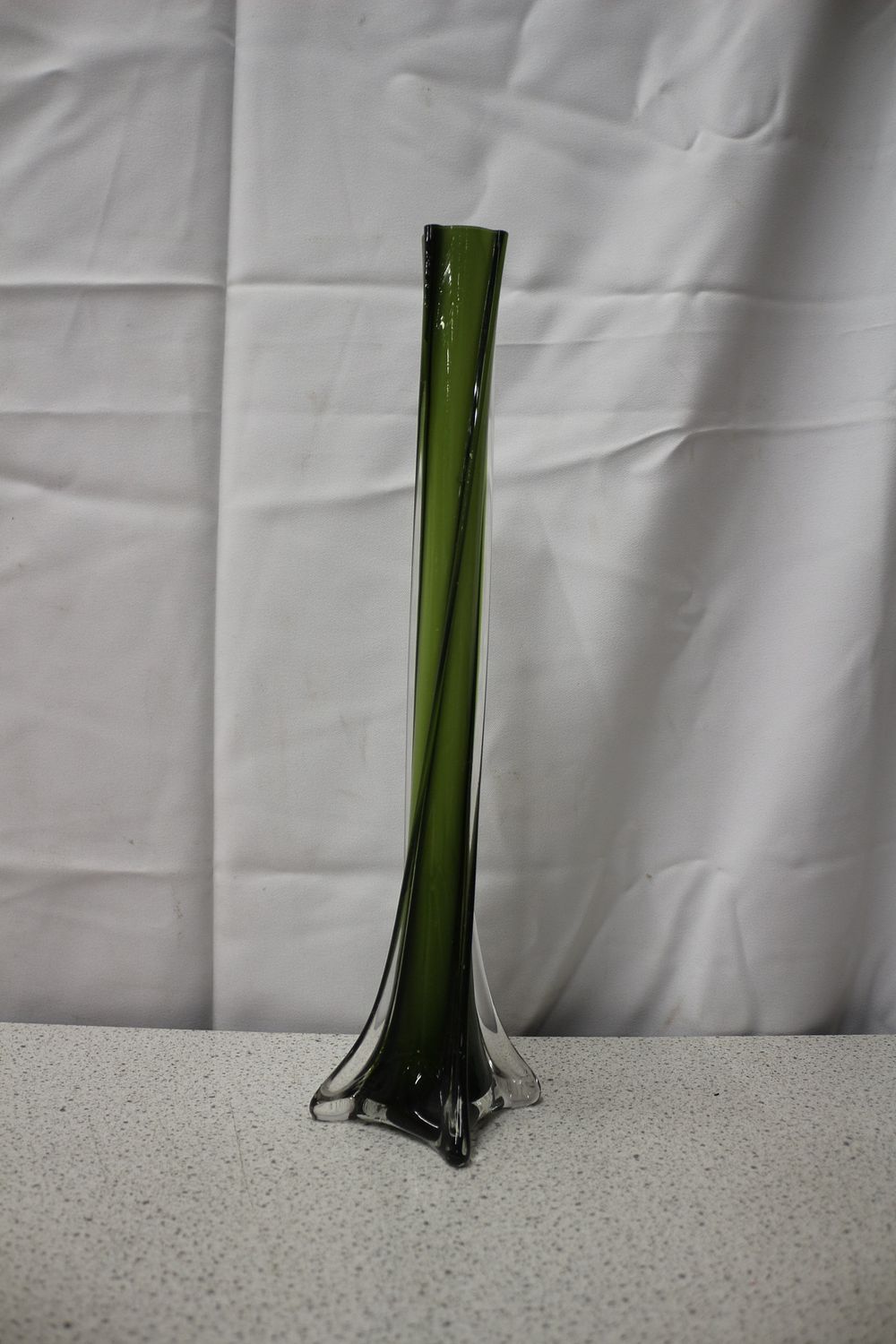 Lot 254: Mid Century Vintage Tall Slender Green and Clear Swirling Art Glass Vase with Elephant Foot