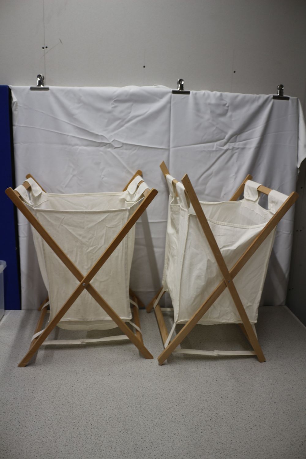 Lot 340: A Pair of Household Essentials Wood X-Frame Laundry Hampers