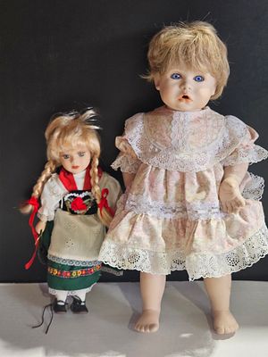 Two Contemporary and Souvenir Folk Costume Dolls. This lot features a large contemporary baby 