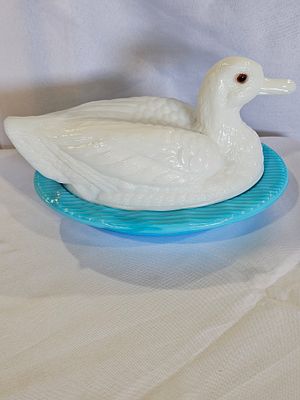 Milk Glass Duck Covered Dish on Light Blue Fluted Base. This two-piece pressed glass covered 