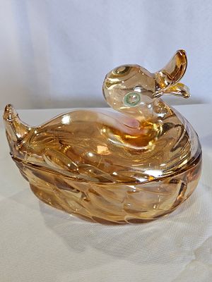 Marigold Carnival Glass Rabbit on Nest Lidded Dish. This two-piece pressed glass dish is molded 