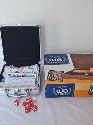 A Collection of Tabletop Games Including Cardinal Mexican Train Dominoes and WE Games Shut the Box. 