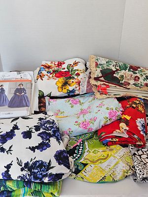 Assortment of Floral Dressmaking Fabrics and Commercial Sewing Patterns. This group features 