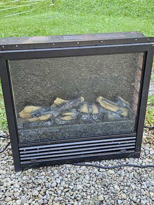 Black Metal 1500W Electric Fireplace Insert with Glass Front. This Chinese-made electric 