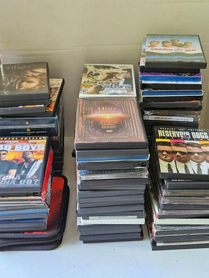 An Assorted Collection of DVD and Blu-ray Movie Discs. This group includes a variety of feature 