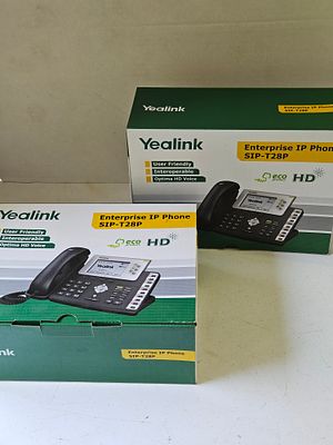 A Pair of Yealink SIP-T28P Enterprise IP Phones. This pair of professional Yealink SIP-T28P 