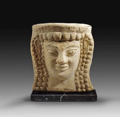 Early Greek antefix (roof tile) with woman&acute;s head. Late Daedalic Style, end 7th - early 6th 