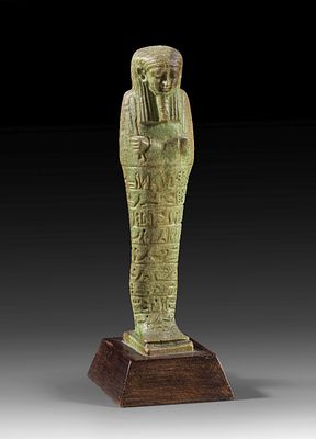 Shabti of Imipasheryhapy. Shabti of Imipasheryhapy of green faience, H 16.4cm (without wooden 