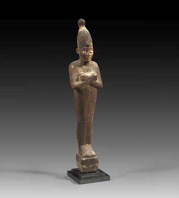 Wooden Osiris. Third Intermediate Period, 25th dynasty, ca. 700 BC. H 27,8cm. Mummy-shaped 