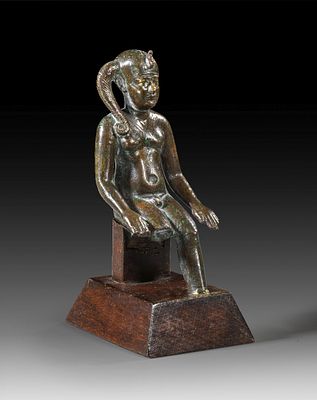 Bronze statuette of naked sitting Harpocrates. Bronze statuette of naked sitting Harpocrates 