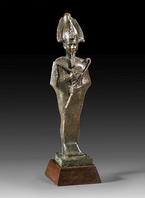 Bronze statuette of Osiris. Bronze statuette of Osiris, mummy-like figure wearing an atef crown 