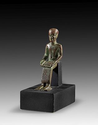 Statuette of seated Imhotep. Statuette of seated Imhotep, bronze solid cast. The eyes inlaid, H 