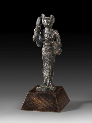 Bronze statuette of standing Bastet. Bronze statuette of standing Bastet with a human body and 