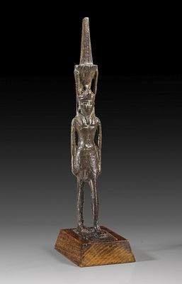 Bronze statuette of the standing Nefertem. Bronze statuette of the standing Nefertem wearing a 
