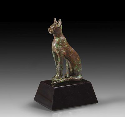 A bronze figure of a cat. A bronze figure of a cat seated with erect ears representing the 
