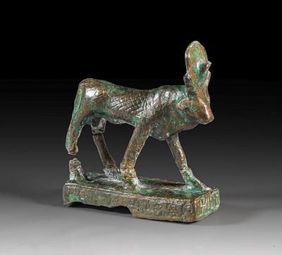 Bronze statuette of an Apis bull. Bronze statuette of an Apis bull with sun disc and uraeus 