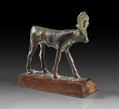 Bronze statuette of an Apis bull. Bronze statuette of an Apis bull with sun disc and uraeus 