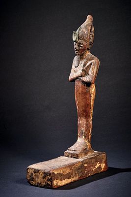 Osiris. Wood with traces of gilding, H 23.5cm. Mummiform, standing figure with ceremonial 