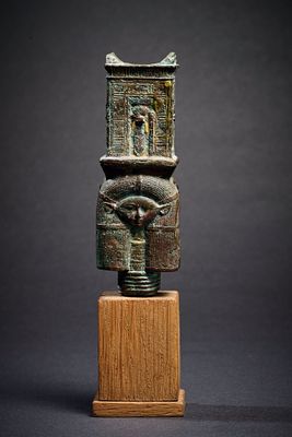 Part of a bronze sistrum. Part of a bronze sistrum with the head of the goddess Hathor lavishly 