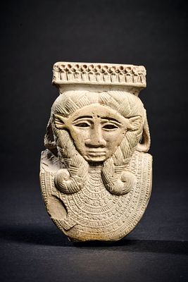 Part of a faience sistrum. Part of a faience sistrum with the head of the goddess Hathor 
