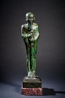 Bronze figurine of Ptah. Bronze figurine of Ptah holding a Was-Sceptre. Beard and collar finely 