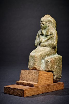 Figure of Chepre. Figure of the enthroned Chepre. Green feldspar, H 10cm. Mummy-shaped figure 