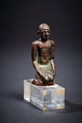 Kneeling priest. A nice bronze figure of a kneeling priest. Late Period, 664 - 323 BC. 