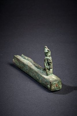Reliquary with a snake goddess. A bronze reliquiary shrine with the snake-bodied goddess Wadjet 