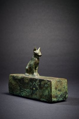 Miniature sarcophagus with a cat. Miniature bronze sarcophagus with a cat on top. Late to 